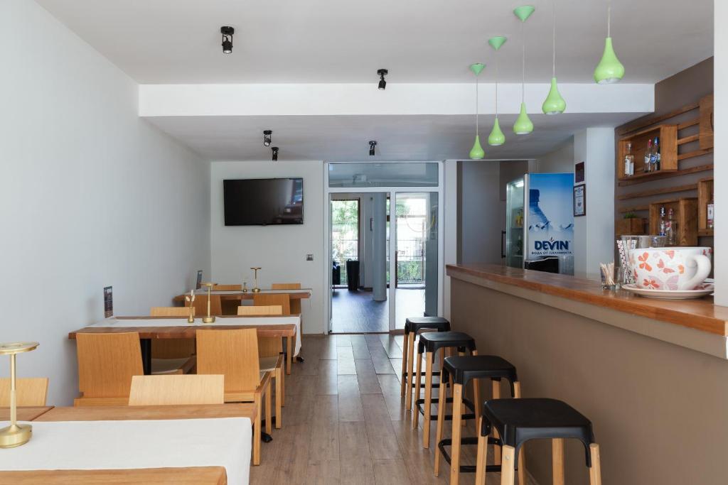 TV a/nebo společenská místnost v ubytování Hotel Milan