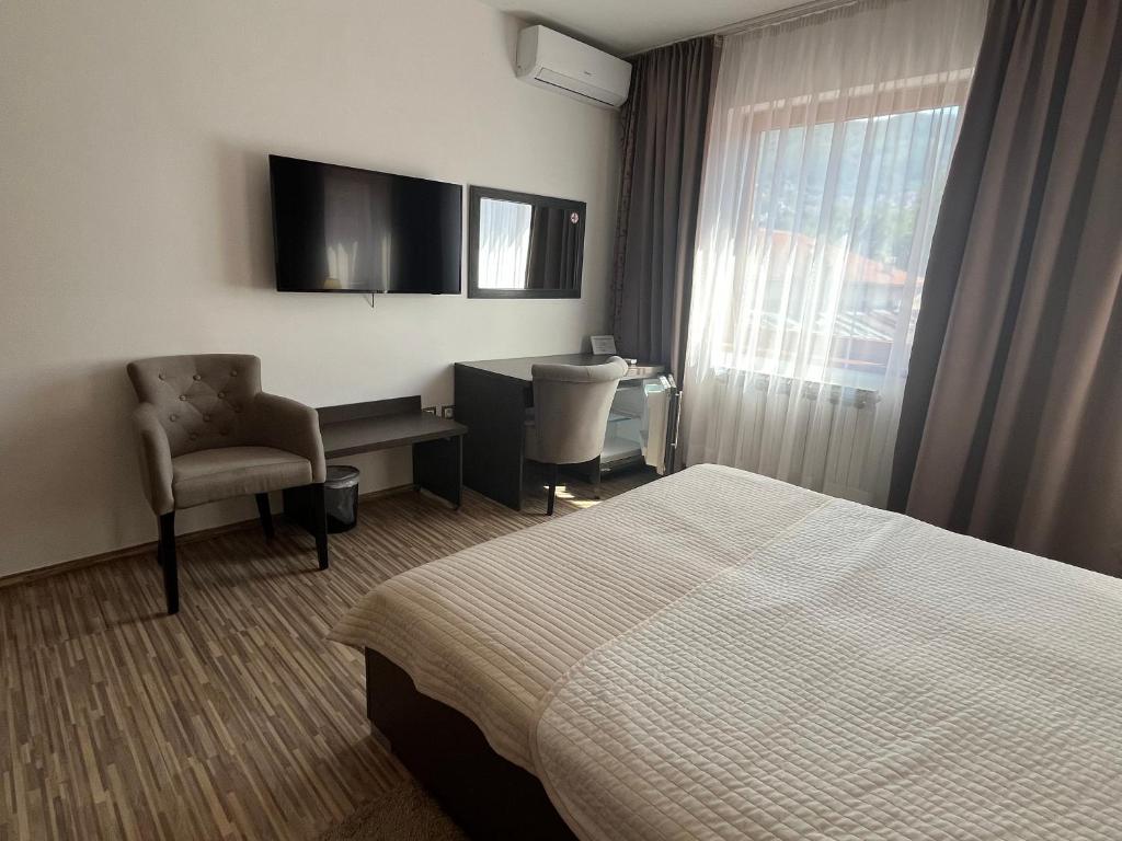 TV a/nebo společenská místnost v ubytování Hotel Divan