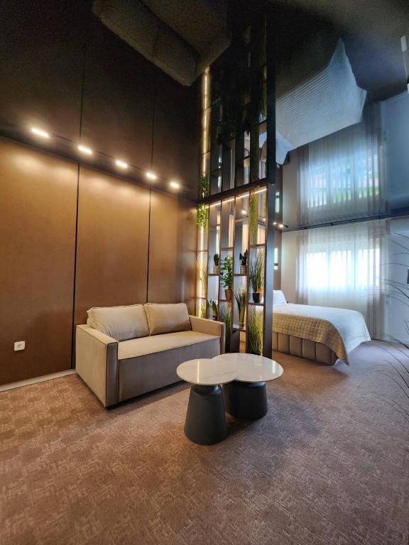 Postel nebo postele na pokoji v ubytování Harmony Apartments
