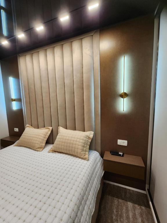 Postel nebo postele na pokoji v ubytování Harmony Apartments