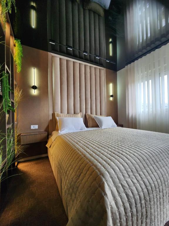 Postel nebo postele na pokoji v ubytování Harmony Apartments