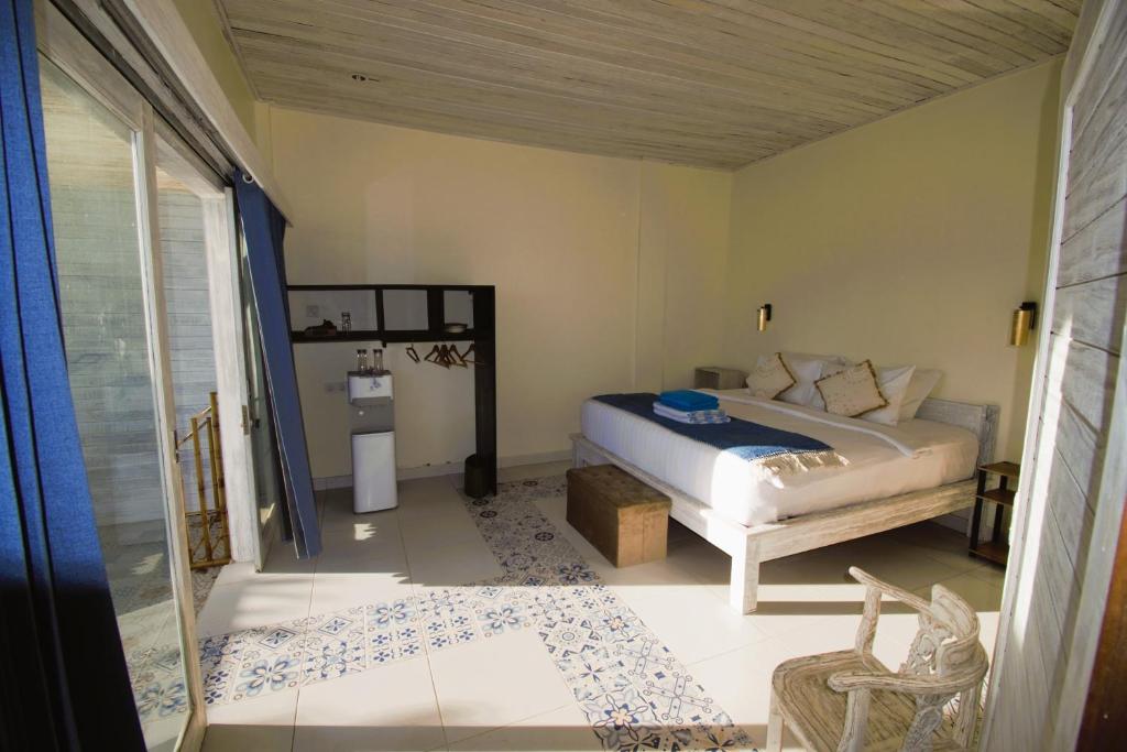 Postel nebo postele na pokoji v ubytování Nusa View - Oceanfront Rentals
