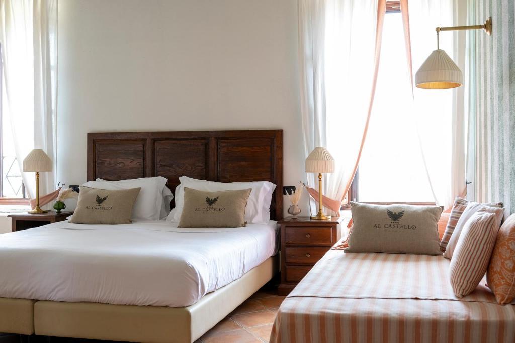 Postel nebo postele na pokoji v ubytování Al Castello Resort