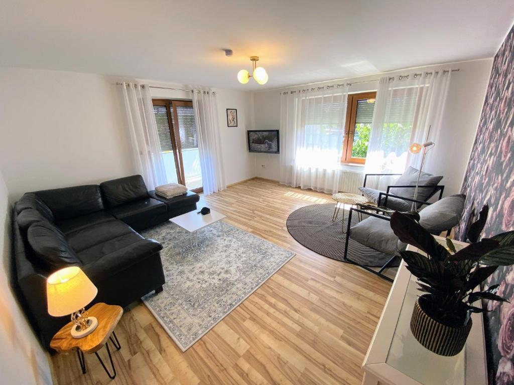 an aerial view of a living room with a couch at 4 Zimmer Wohnung, 6 Bed, Küche, Waschmaschine, Wlan, Garden, free Parking in Tacherting