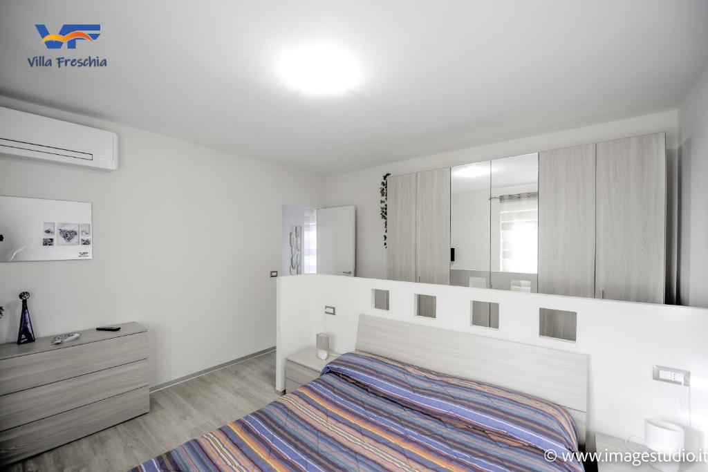 A bed or beds in a room at Villa Freschìa