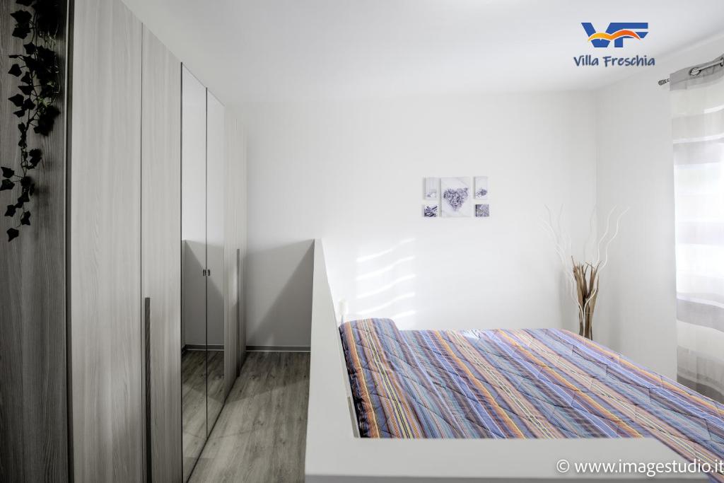 A bed or beds in a room at Villa Freschìa