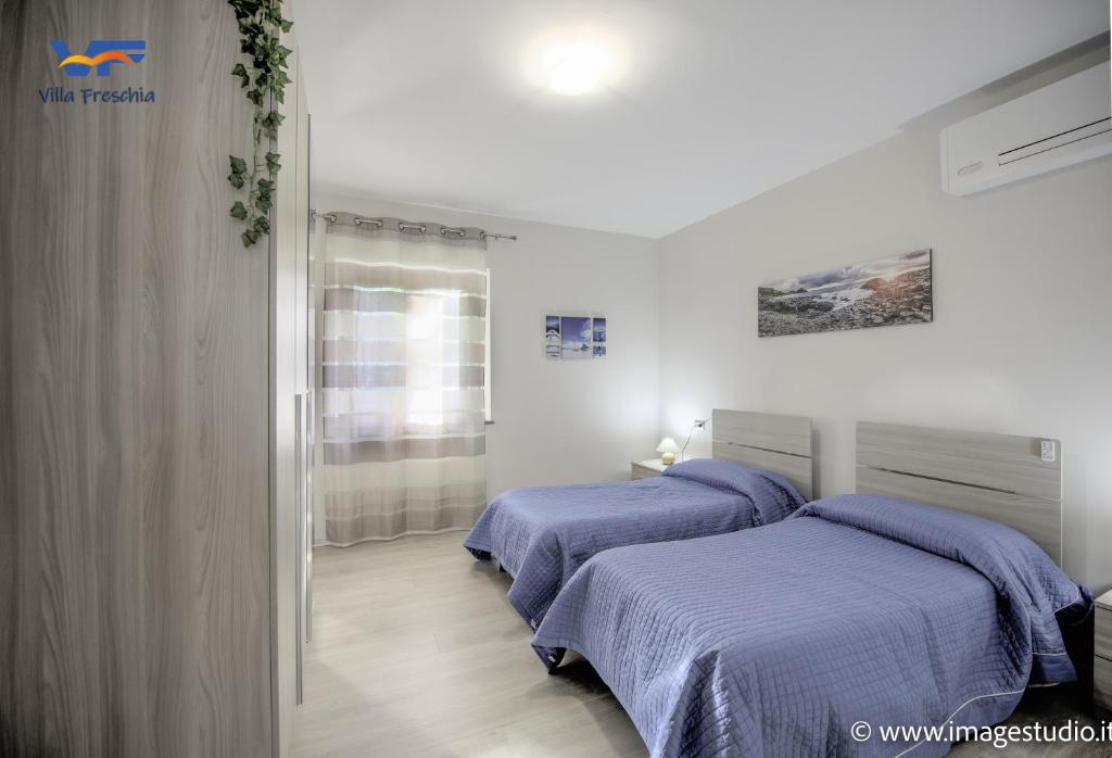 A bed or beds in a room at Villa Freschìa