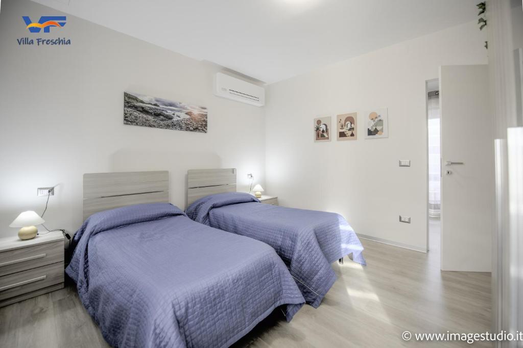 A bed or beds in a room at Villa Freschìa