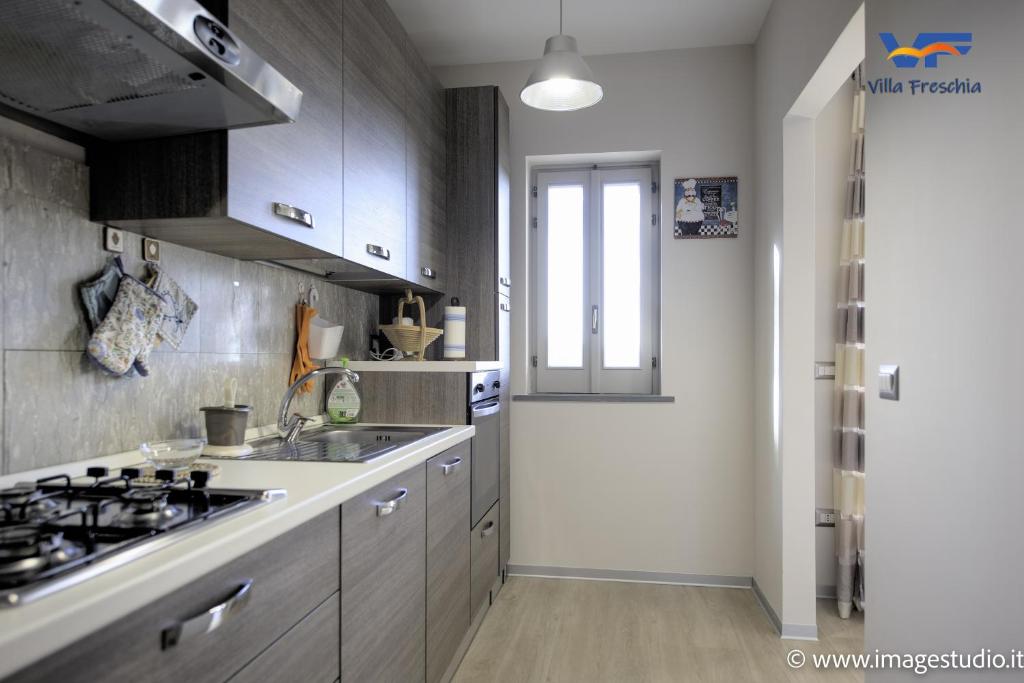 A kitchen or kitchenette at Villa Freschìa