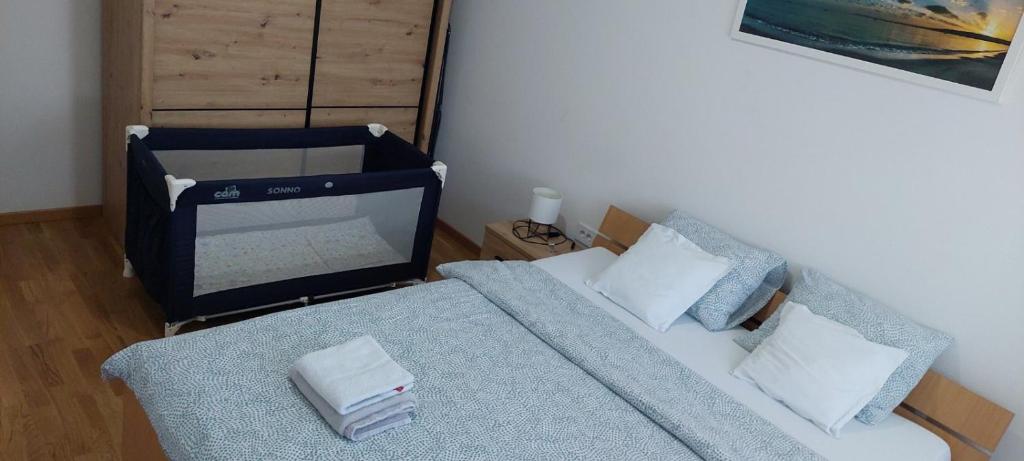 Postel nebo postele na pokoji v ubytování Apartman N&N