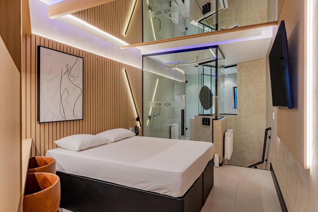 Postel nebo postele na pokoji v ubytování Monn Cherry Motel