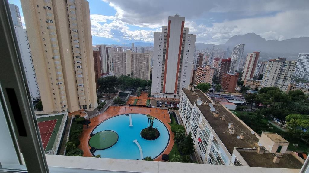 arial view of a city with a swimming pool at Elena77 in Benidorm