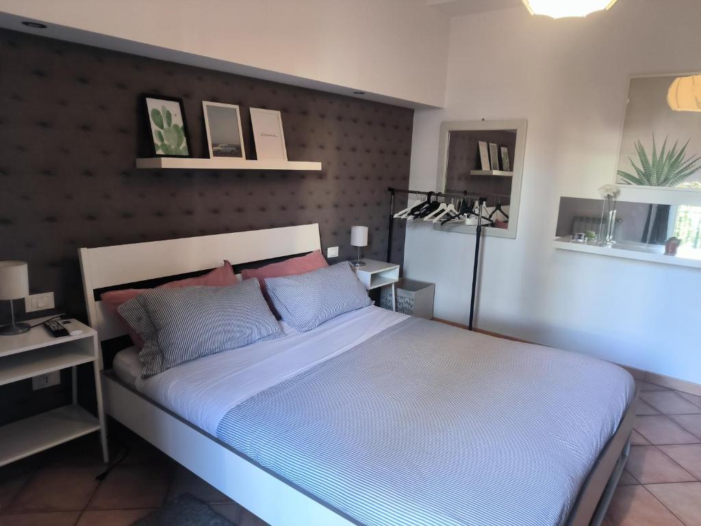Łóżko lub łóżka w pokoju w obiekcie Etna Holidays Home SereLeo