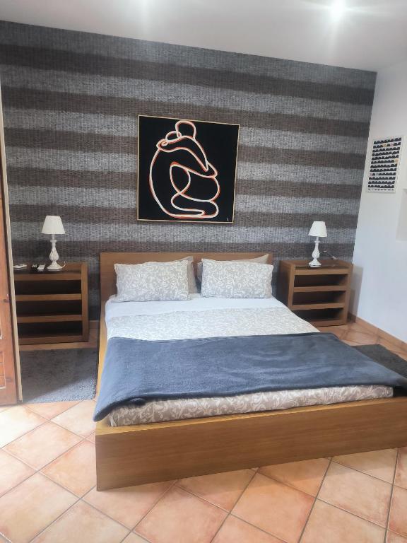 Łóżko lub łóżka w pokoju w obiekcie Etna Holidays Home SereLeo