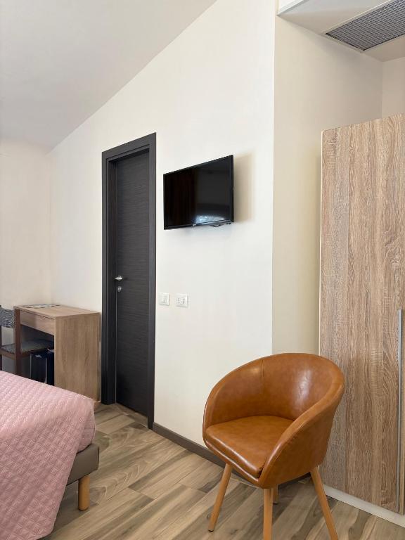 A television and/or entertainment centre at Hotel Villa Mare