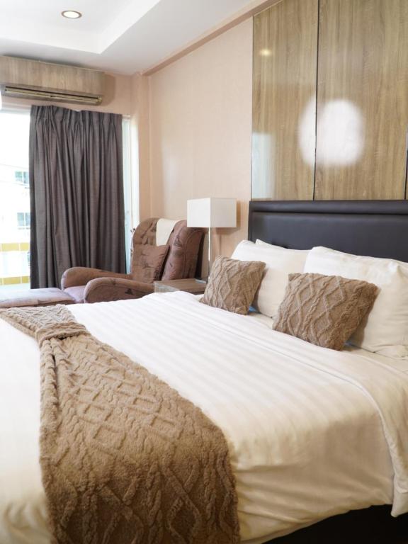 Postel nebo postele na pokoji v ubytování Maya Residence