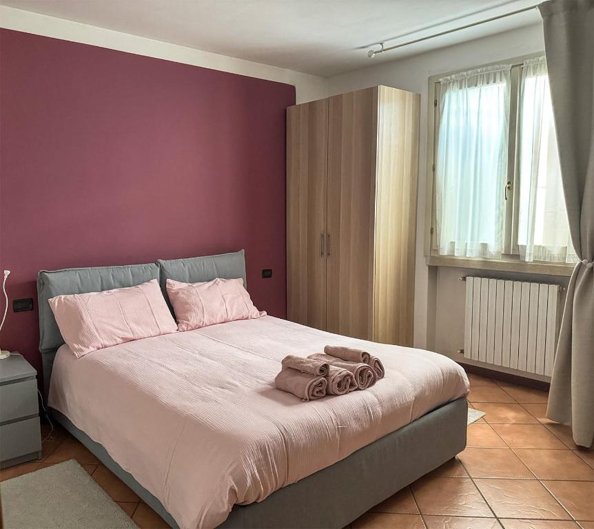 Postel nebo postele na pokoji v ubytování Residence Franciacorta