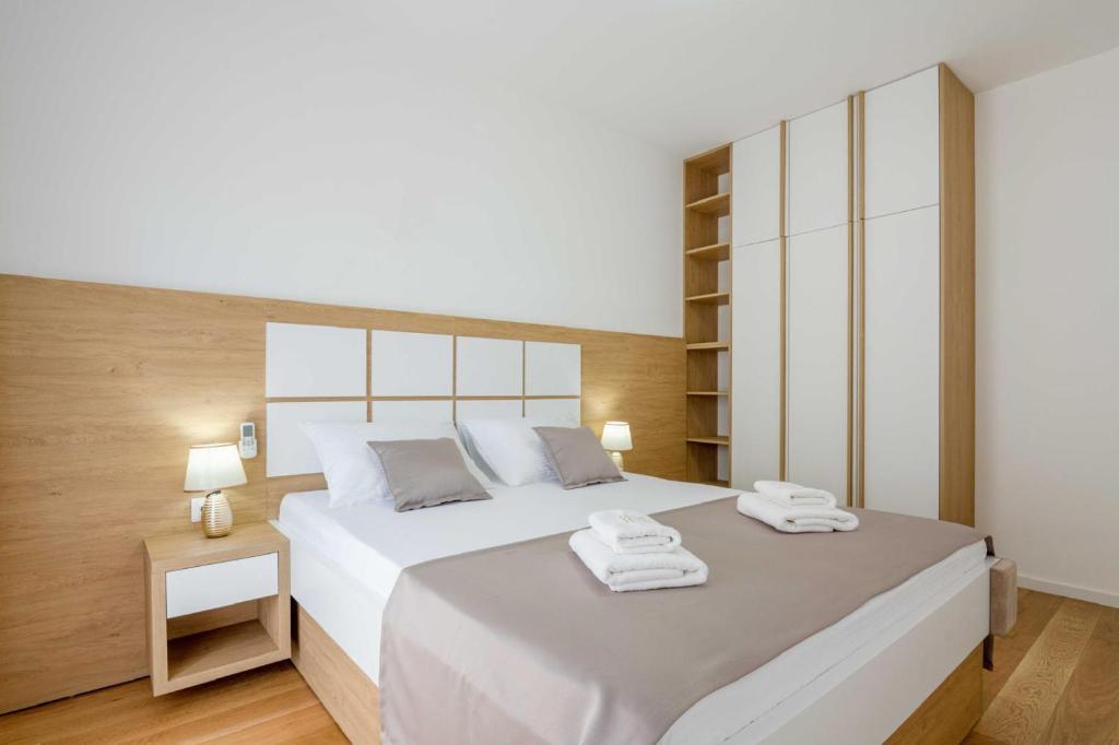 Postel nebo postele na pokoji v ubytování Apartments BB