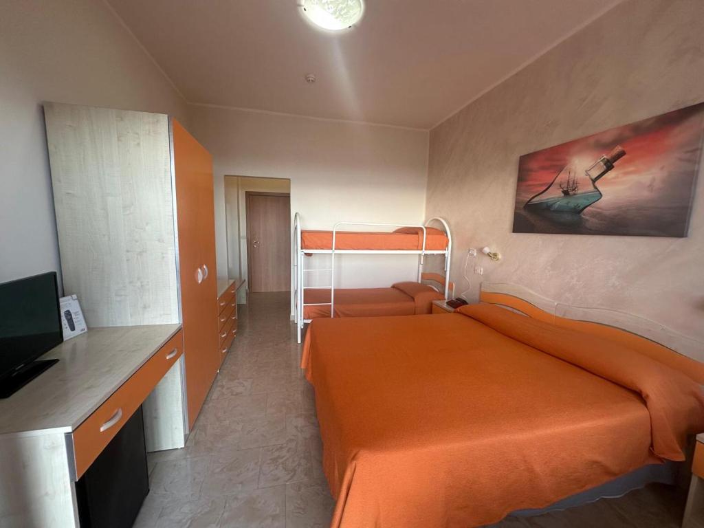 Postel nebo postele na pokoji v ubytování Hotel Germania