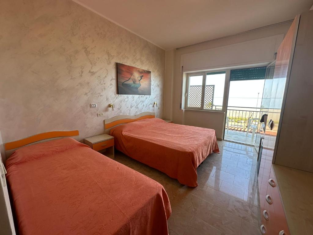 Postel nebo postele na pokoji v ubytování Hotel Germania