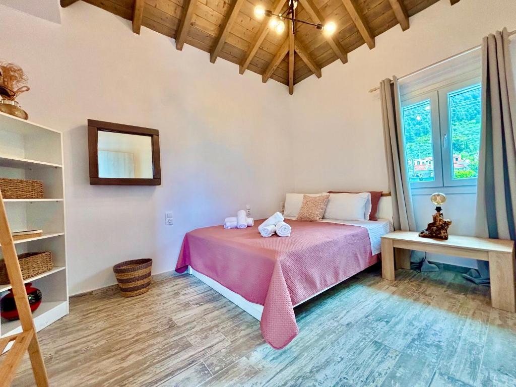 Postel nebo postele na pokoji v ubytování Elios Serenity House