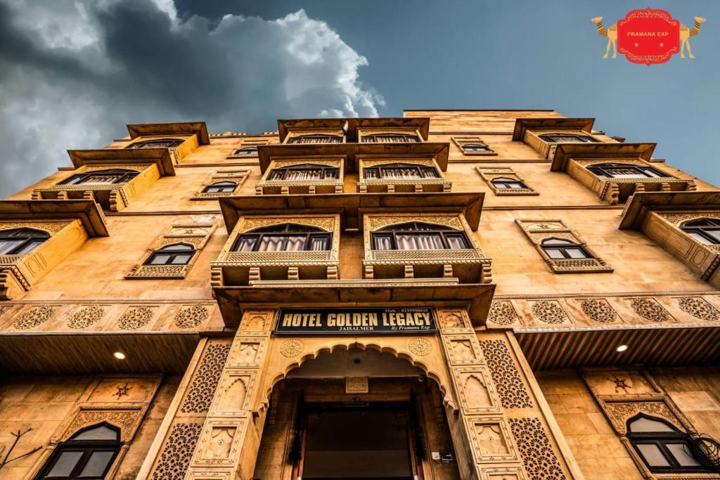 a tall building with many windows on the side of it at Hotel Golden Legacy - by PRAMANA EXP in Jaisalmer