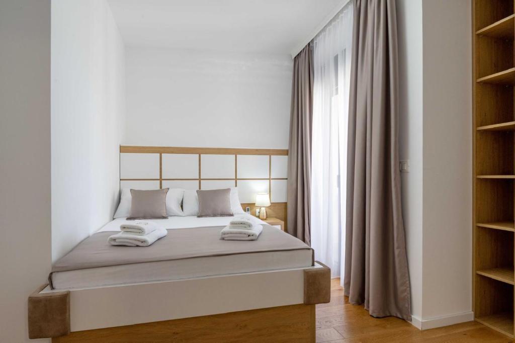 Postel nebo postele na pokoji v ubytování Apartments BB
