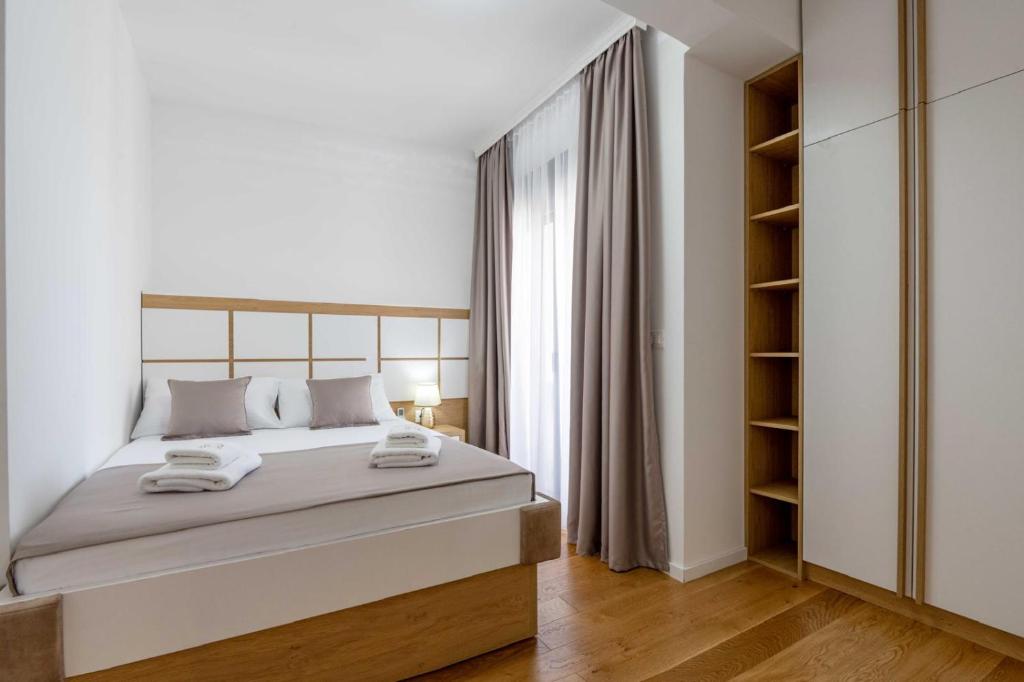Postel nebo postele na pokoji v ubytování Apartments BB