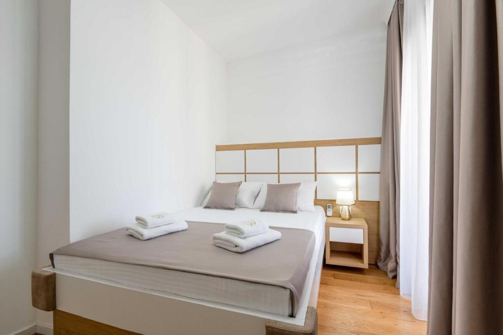 Postel nebo postele na pokoji v ubytování Apartments BB