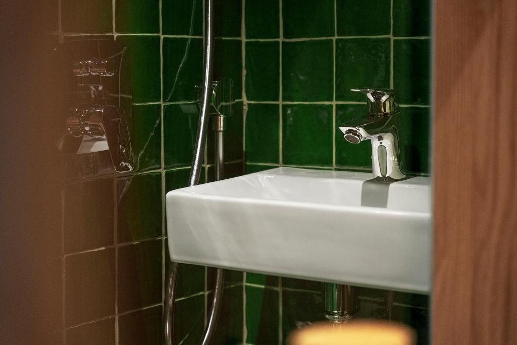 Koupelna v ubytování GRAACE House Suites