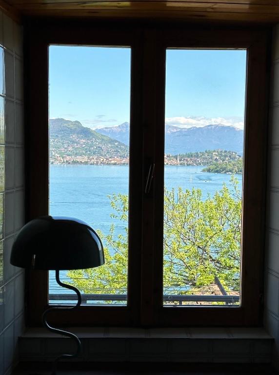 a window with a view of the water at Casa Del Signore III in Baveno