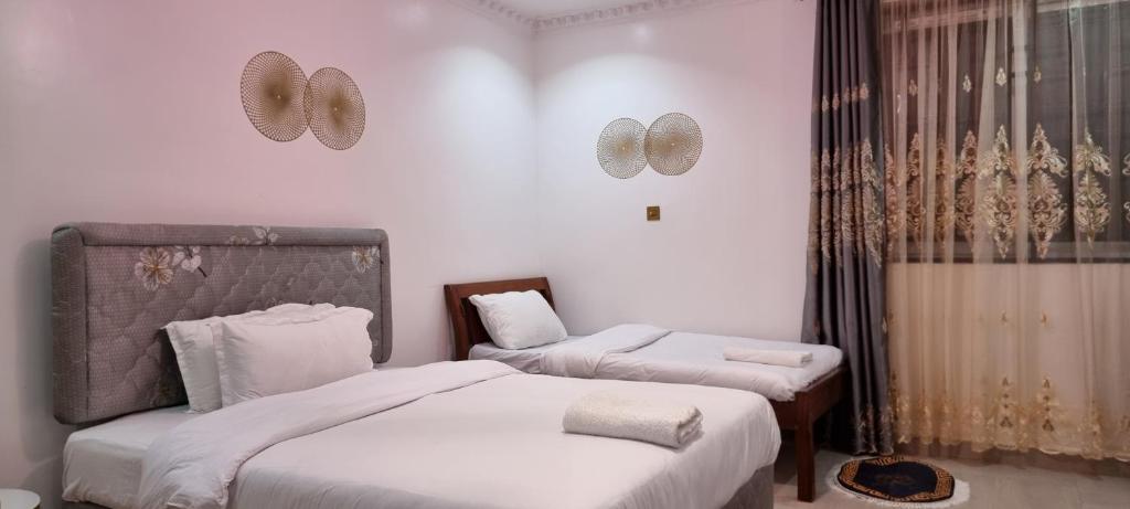 Postel nebo postele na pokoji v ubytování Casa Nadreya Home