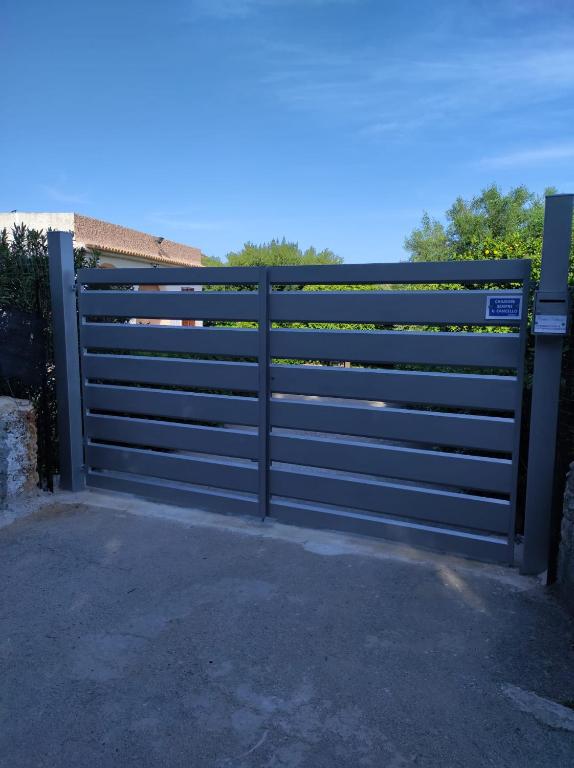 a gate in front of a house at Casa Natura in Avola