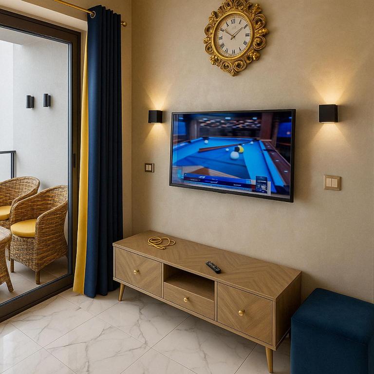 A television and/or entertainment centre at Porto Said Resort Rentals