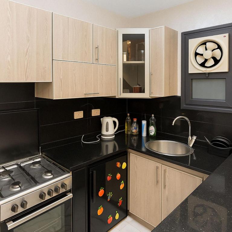A kitchen or kitchenette at Porto Said Resort Rentals
