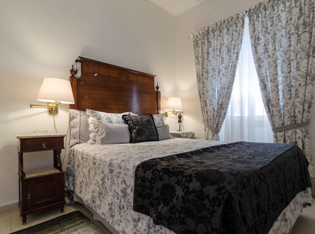 a bedroom with a large bed and a window at Beautiful apartment in the city centre T1B in Lagos
