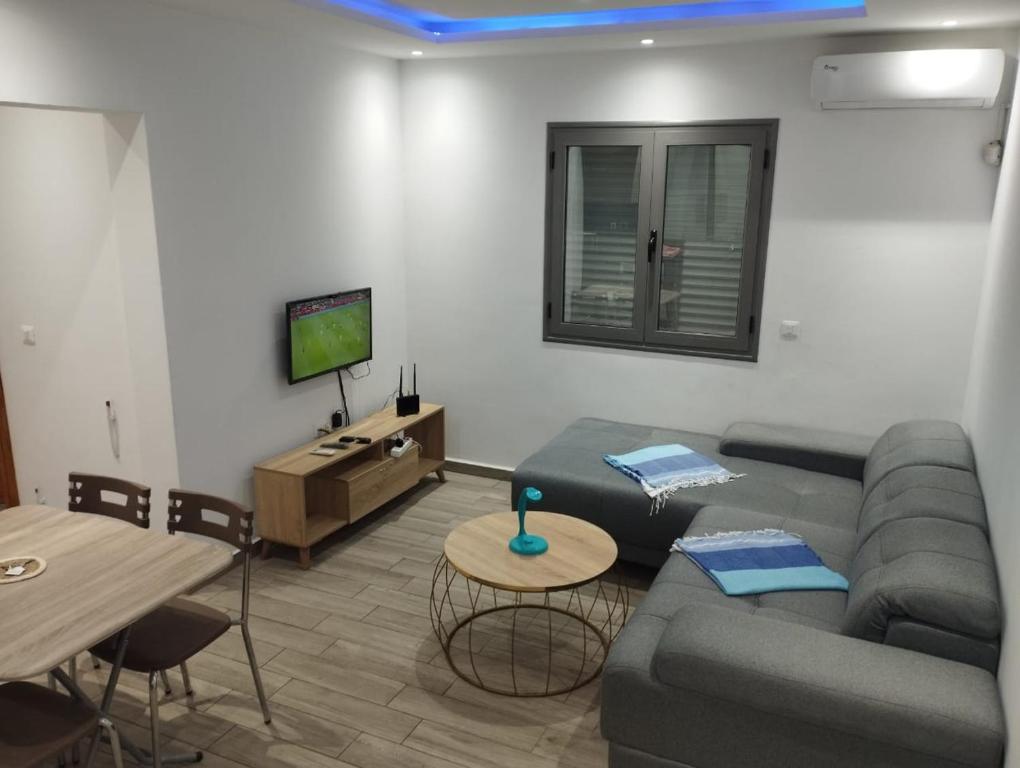 TV a/nebo společenská místnost v ubytování Résidence Inès Djerba Appartement de Luxe