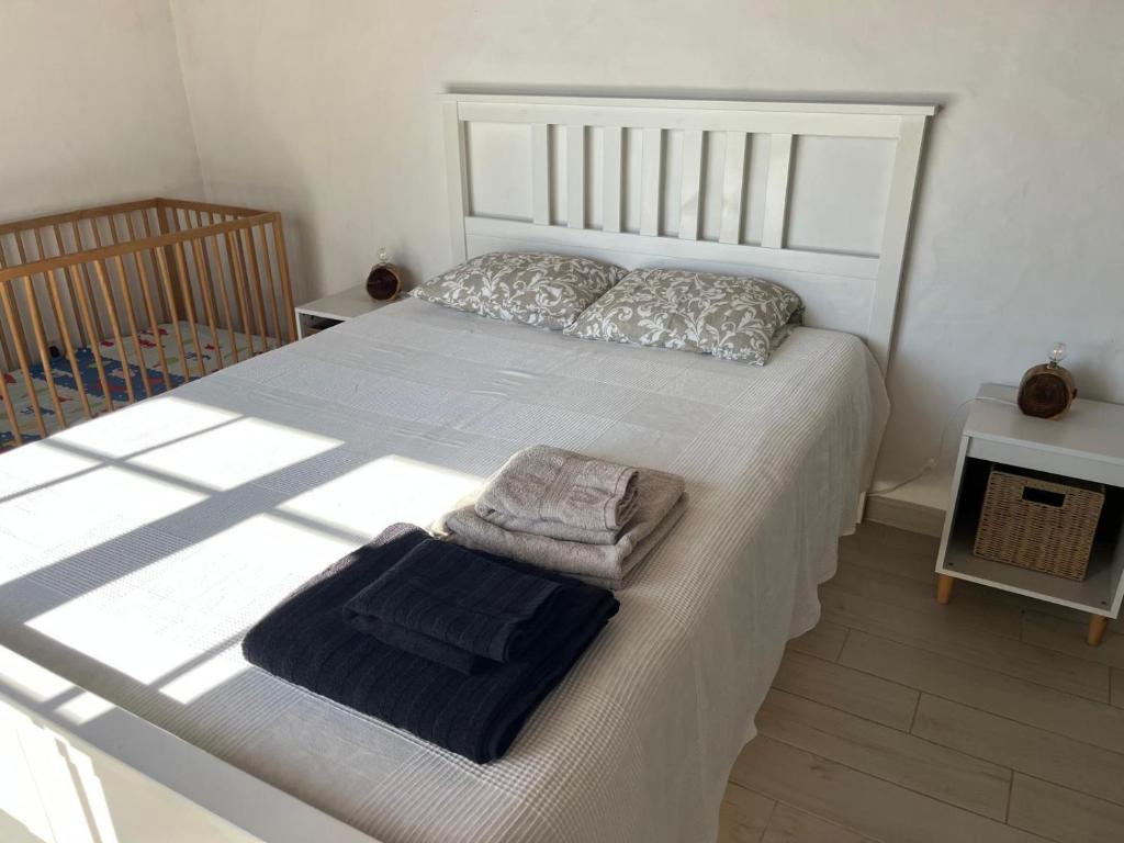 Postel nebo postele na pokoji v ubytování Villa Monte dos Pinheiros