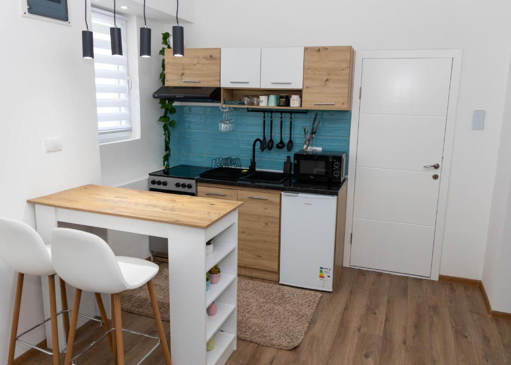 Kuchyň nebo kuchyňský kout v ubytování La Vida Apartman