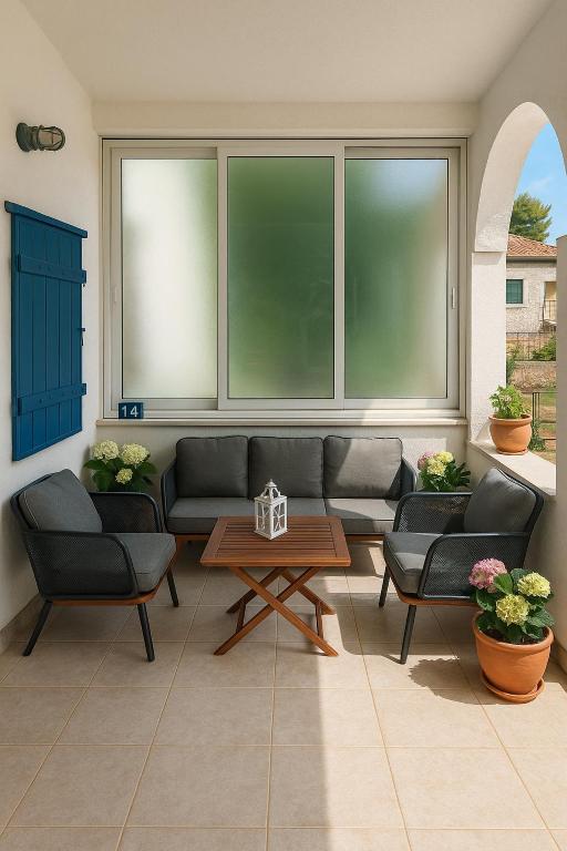 a living room with couches and a coffee table at House Natale in Donje Selo na Šolti