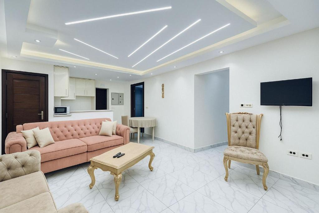 A television and/or entertainment centre at Seaside Serenity - Family Chalet with Modern Comforts