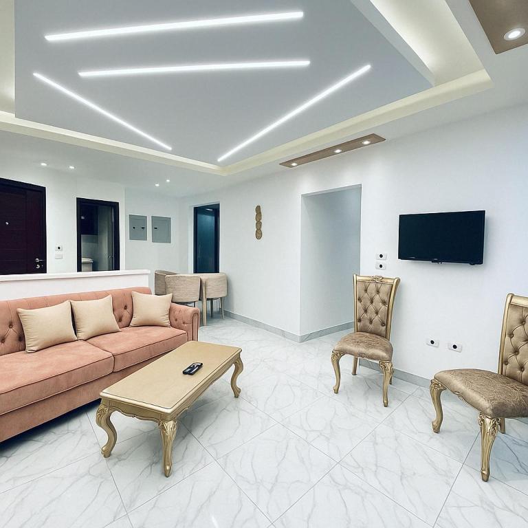 A television and/or entertainment centre at Seaside Serenity - Family Chalet with Modern Comforts