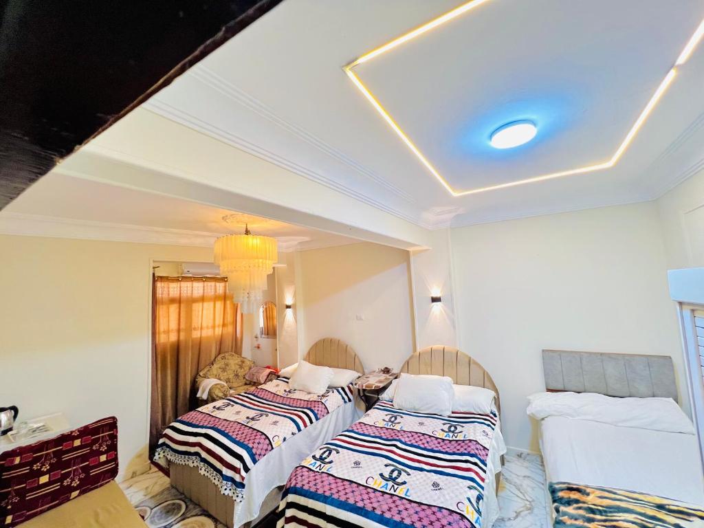 Postel nebo postele na pokoji v ubytování Star Vysta pyramids hotel