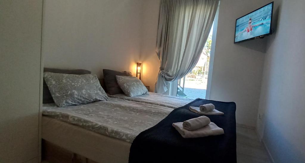 Posteľ alebo postele v izbe v ubytovaní Apartament Koszałka