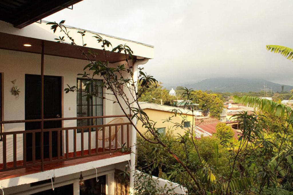 a balcony of a house with a view of a mountain at Casa Don Quijote in Concepción de Ataco