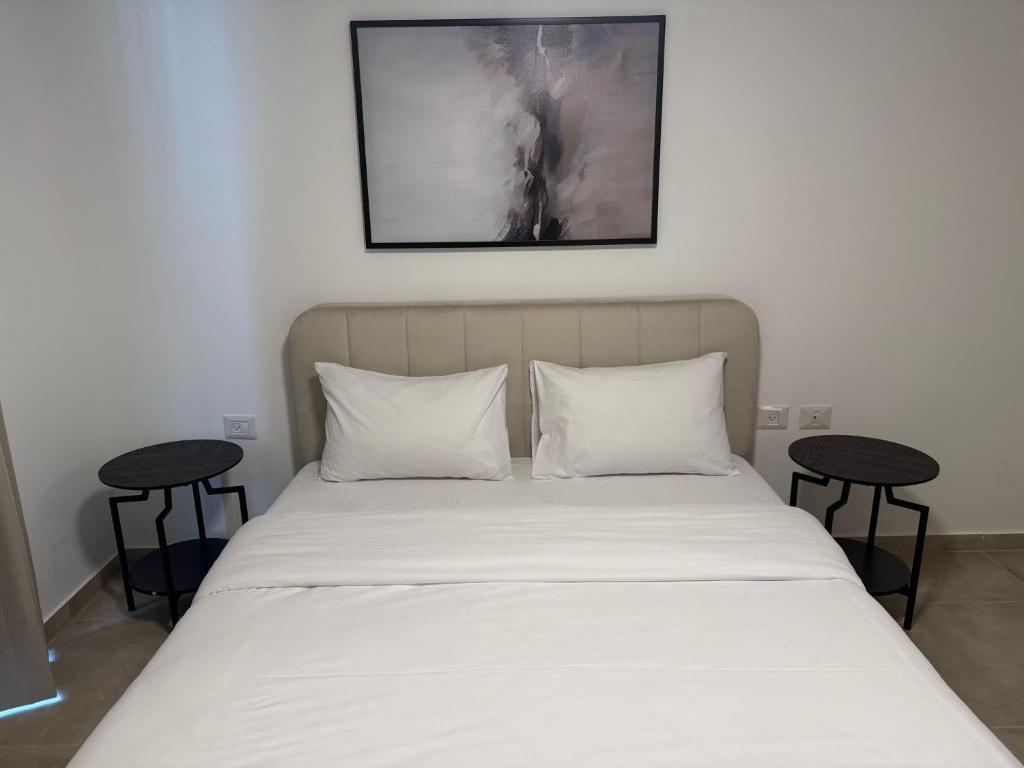 Postel nebo postele na pokoji v ubytování J&G Suites