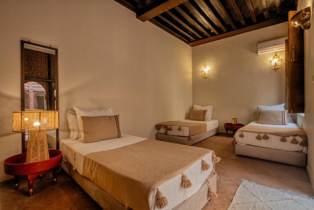 Postel nebo postele na pokoji v ubytování Riad Tassili Marrakech