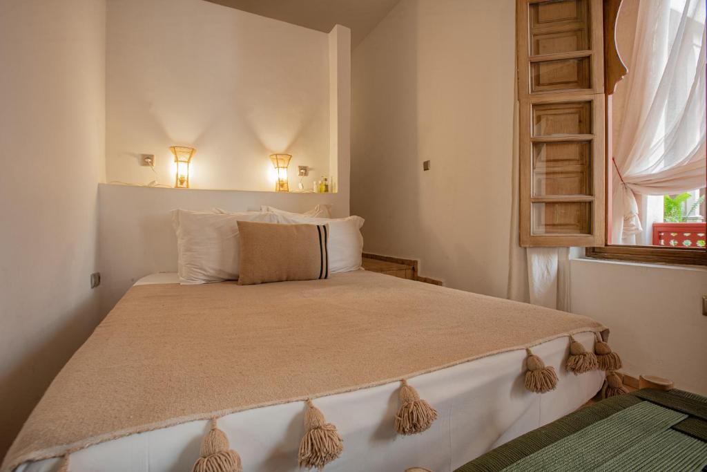 Postel nebo postele na pokoji v ubytování Riad Tassili Marrakech