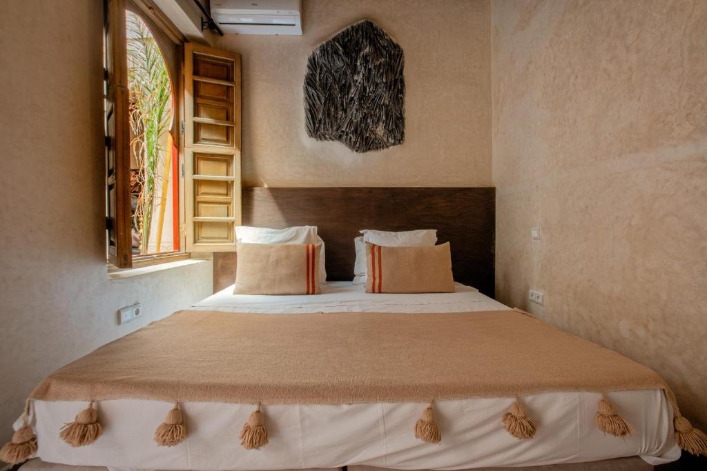 Postel nebo postele na pokoji v ubytování Riad Tassili Marrakech