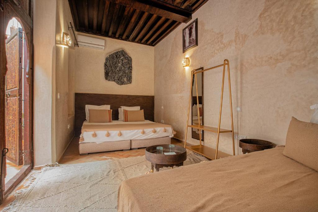 Postel nebo postele na pokoji v ubytování Riad Tassili Marrakech